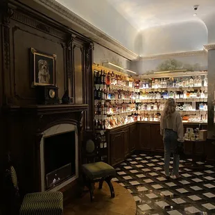 Waiting area with a fine selection of liquors to browse (the secret entrance to the bar is in this photo