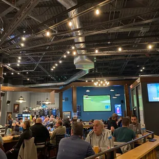 a large group of people sitting at tables