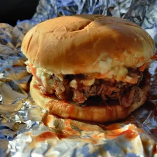 a pulled pork sandwich on a bun