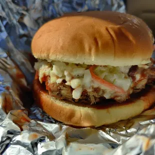 a hamburger with cole slaw