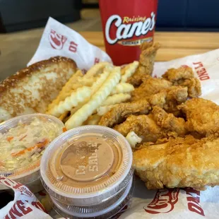 a basket of fried chicken, fries, coleslaw, coleslaw, coleslaw,