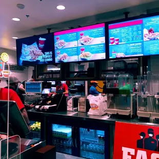 a man in a mask behind the counter