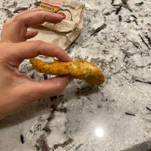 Tiniest chicken strip I&apos;ve ever gotten from a raise and canes