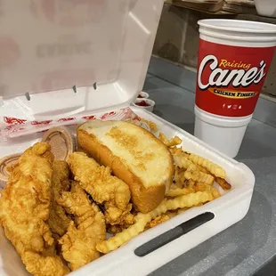 a tray of fried chicken and fries