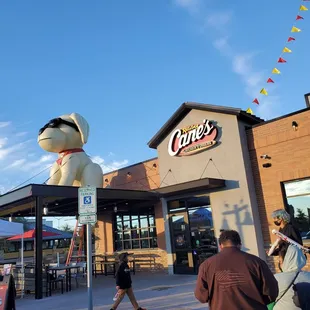 a dog statue in front of a store