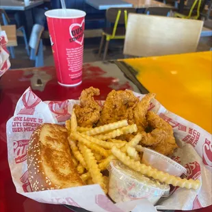 a basket of fried chicken and fries