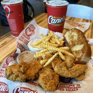 a tray of fried chicken and fries