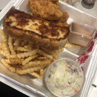 a tray of fries and coleslaw
