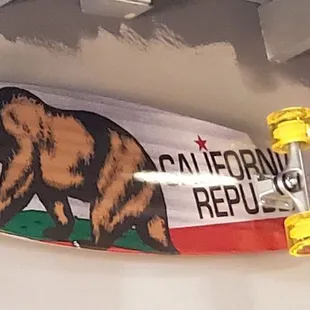 California Republic skateboard on the wall, inside Raising Cane&apos;s in Ceres, CA.