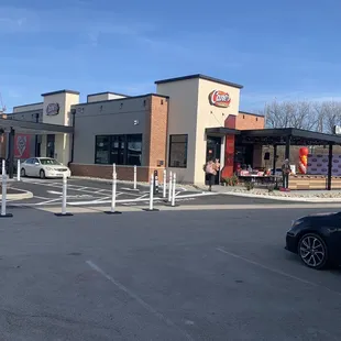 a car parked in front of a restaurant