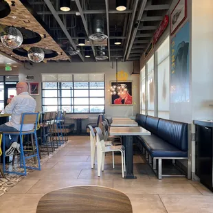a dog sitting on a table in a restaurant