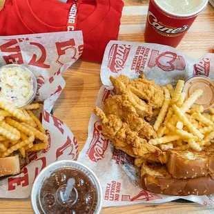 two baskets of fried chicken and french fries