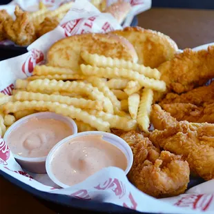 a basket of fried chicken and french fries