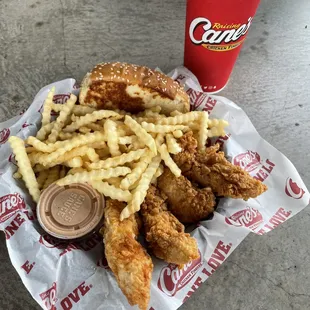 a basket of fried chicken and fries