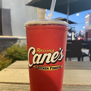 a red cup with a straw