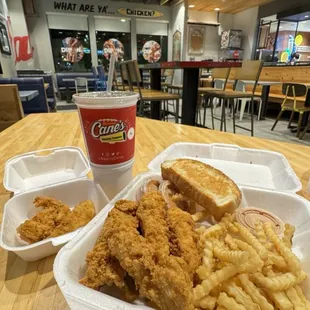 a tray of fried chicken and french fries