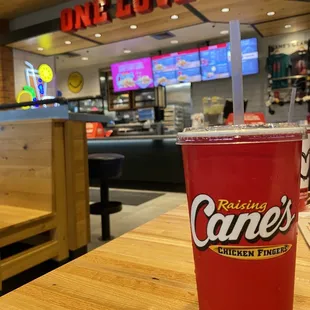 a red cup on a wooden table