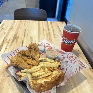 a basket of fried chicken and french fries