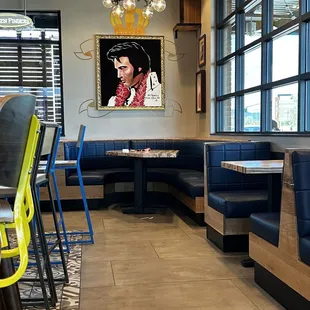 a restaurant with booths and tables