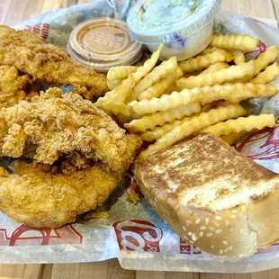 Box combo with 4 chicken fingers, sauce, fries, coleslaw, Texas toast, and a drink,