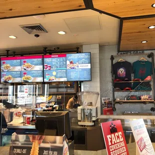 a man standing behind a counter