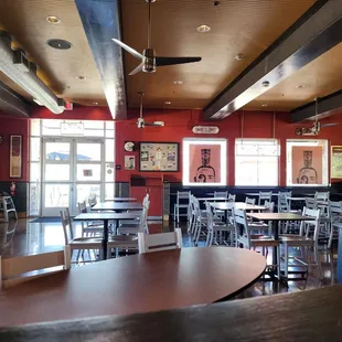 a restaurant with tables and chairs