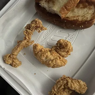 a fried chicken and a piece of bread