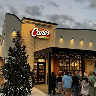 a crowd of people outside a store