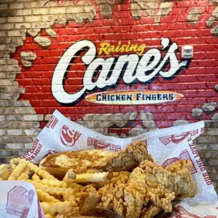 Three Fingers, fries, garlic bread, and Cane's sauce