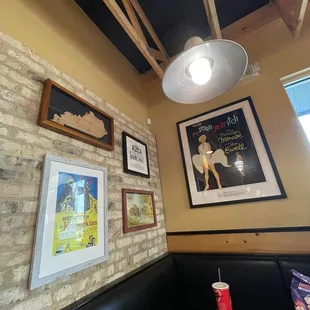 Back left corner booth with some curious wall decor. I might try to find the movie "The Seven Year Itch".