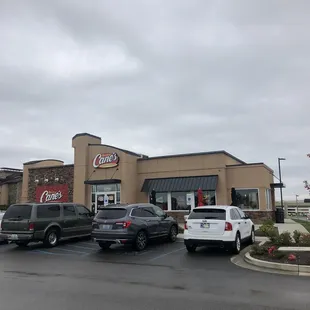 cars parked in front of a restaurant