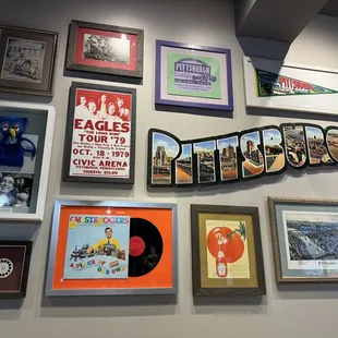 a wall of framed memorabilia