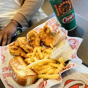 a basket of fried chicken and french fries