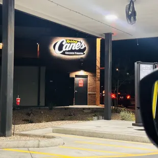 a view of a gas station at night