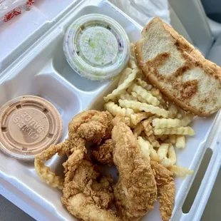 Basic boring chicken tenders with soggy fries and soggy bread and soggy coleslaw.