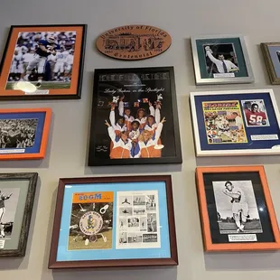 a wall of framed sports memorabilia