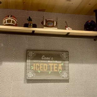 a sign above a coffee shop counter