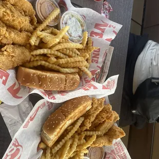 Chicken Fingers, fries, bread, coleslaw, and Cane's Sauce