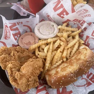 The Box - 4 piece tenders, fries, slaw, garlic bread, Canes sauce