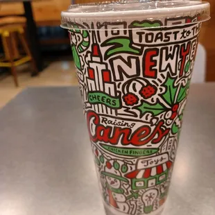 a plastic cup with a straw