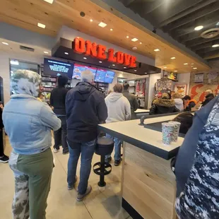 people standing in line at the counter