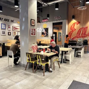 a man sitting at a table in a restaurant