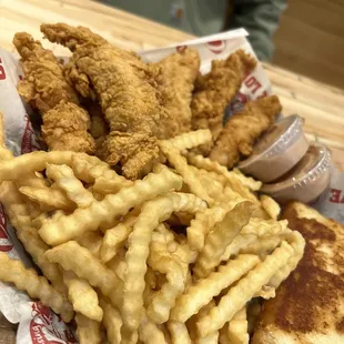 a basket of fried chicken and french fries