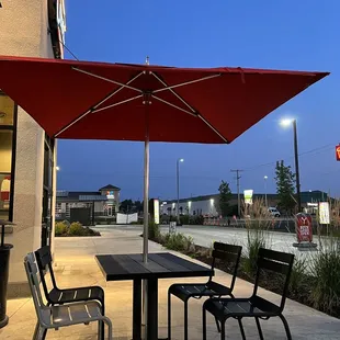a table and chairs outside a restaurant