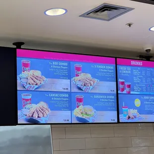 a man standing in front of a menu