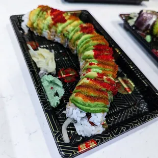 Caterpillar - Savory unagi &amp; cucumber, draped w/ avocado, topped with red &amp; black tobiko. Drizzled with unagi sauce.