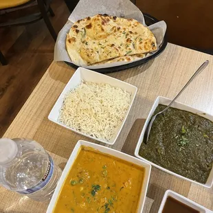 Garlic Nan, rice, vegetable korma, and lamb saag