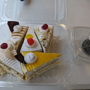 Top to bottom, left to right: Butterscotch, pineapple, rasmalai, lychee, mango. Also apple cake in right box