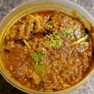 Kadai Chicken (takeout portion)-Boneless chicken cooked with onions, bell pepper, tomatoes and spices