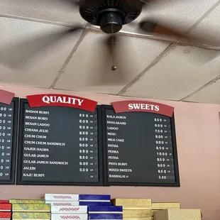 a menu and prices on the wall